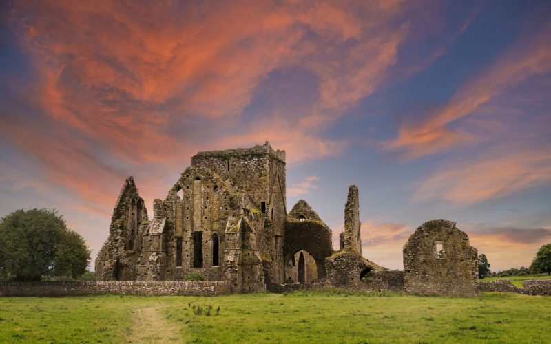 Ruins of Hore Abbey at sunset with reddish clouds, near the Irish village of Cashel. Built by Benedictine monks in the 13th century.